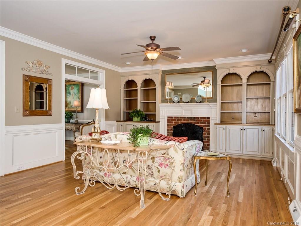 4822 Nora's Path Road Charlotte, NC 28226 - Photo 12 of 24 a living room with fireplace furniture and a wooden floor