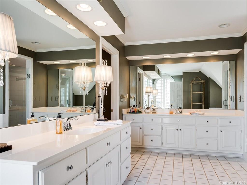 4822 Nora's Path Road Charlotte, NC 28226 - Photo 17 of 24 a bathroom with a granite countertop sink mirror and