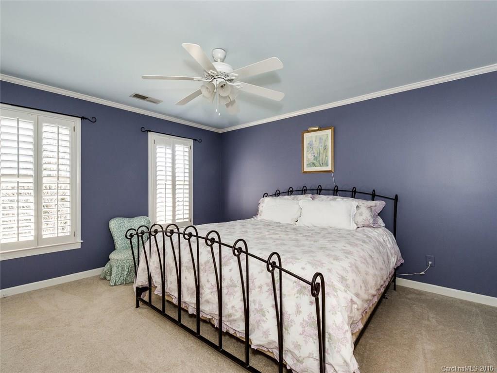 4822 Nora's Path Road Charlotte, NC 28226 - Photo 19 of 24 a bedroom with a bed and a window