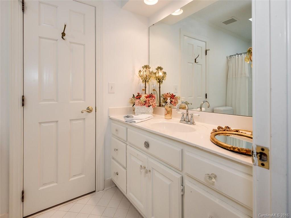 4822 Nora's Path Road Charlotte, NC 28226 - Photo 21 of 24 a bathroom with double sink and a mirror