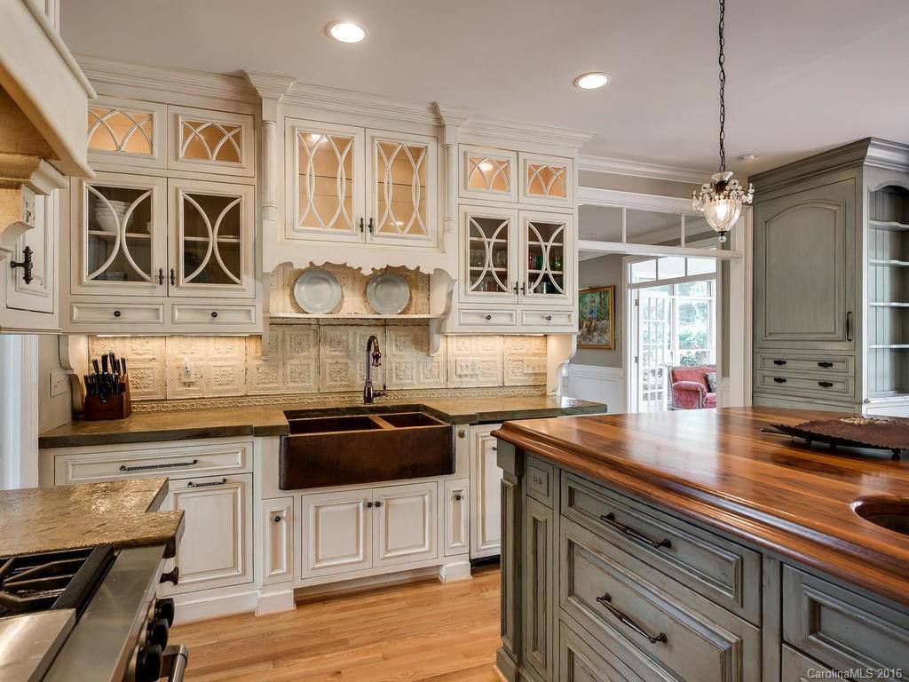 4822 Nora's Path Road Charlotte, NC 28226 - Photo 9 of 24 a kitchen with stainless steel appliances granite countertop a sink and cabinets
