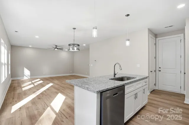 a view of a swimming pool and outdoor seating