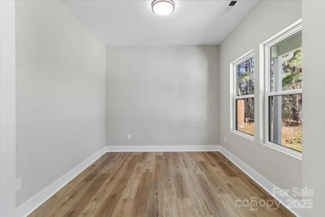 a bathroom with a sink vanity mirror and toilet