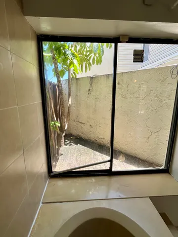 a view of a yard and swimming pool