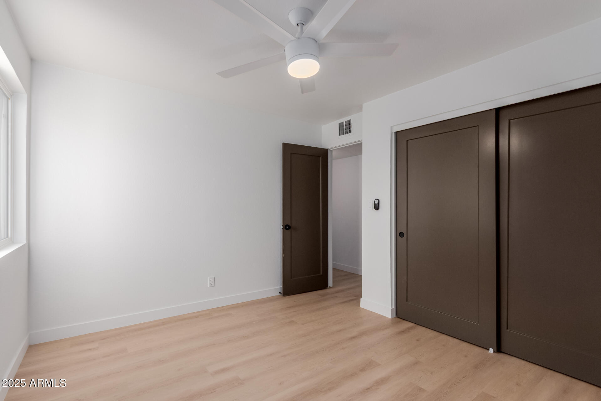 8055 East Thomas Road, Unit M101 Scottsdale, AZ 85251 - Photo 15 of 33 an empty room with closet and a bathroom