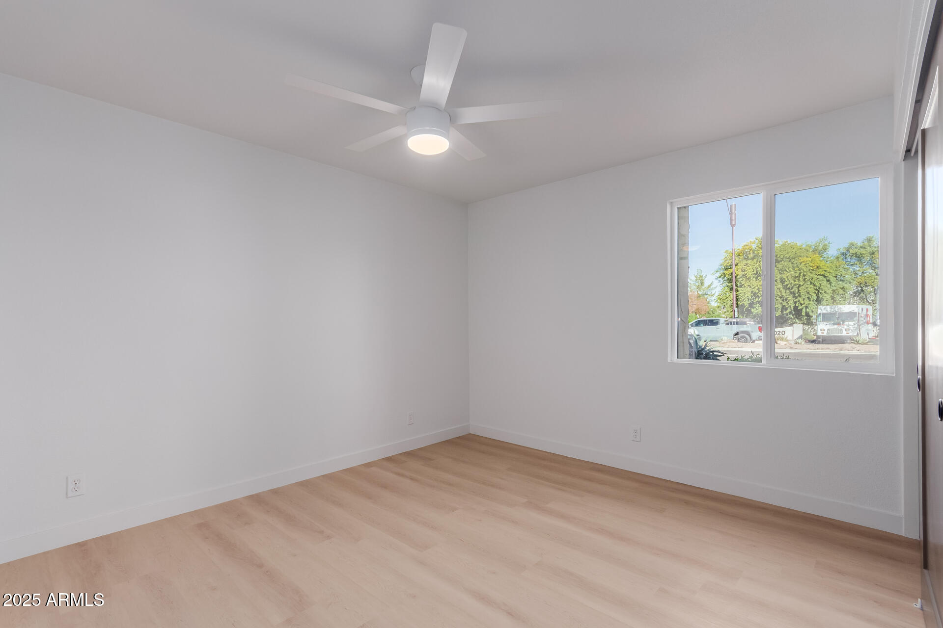 8055 East Thomas Road, Unit M101 Scottsdale, AZ 85251 - Photo 16 of 33 an empty room with a window