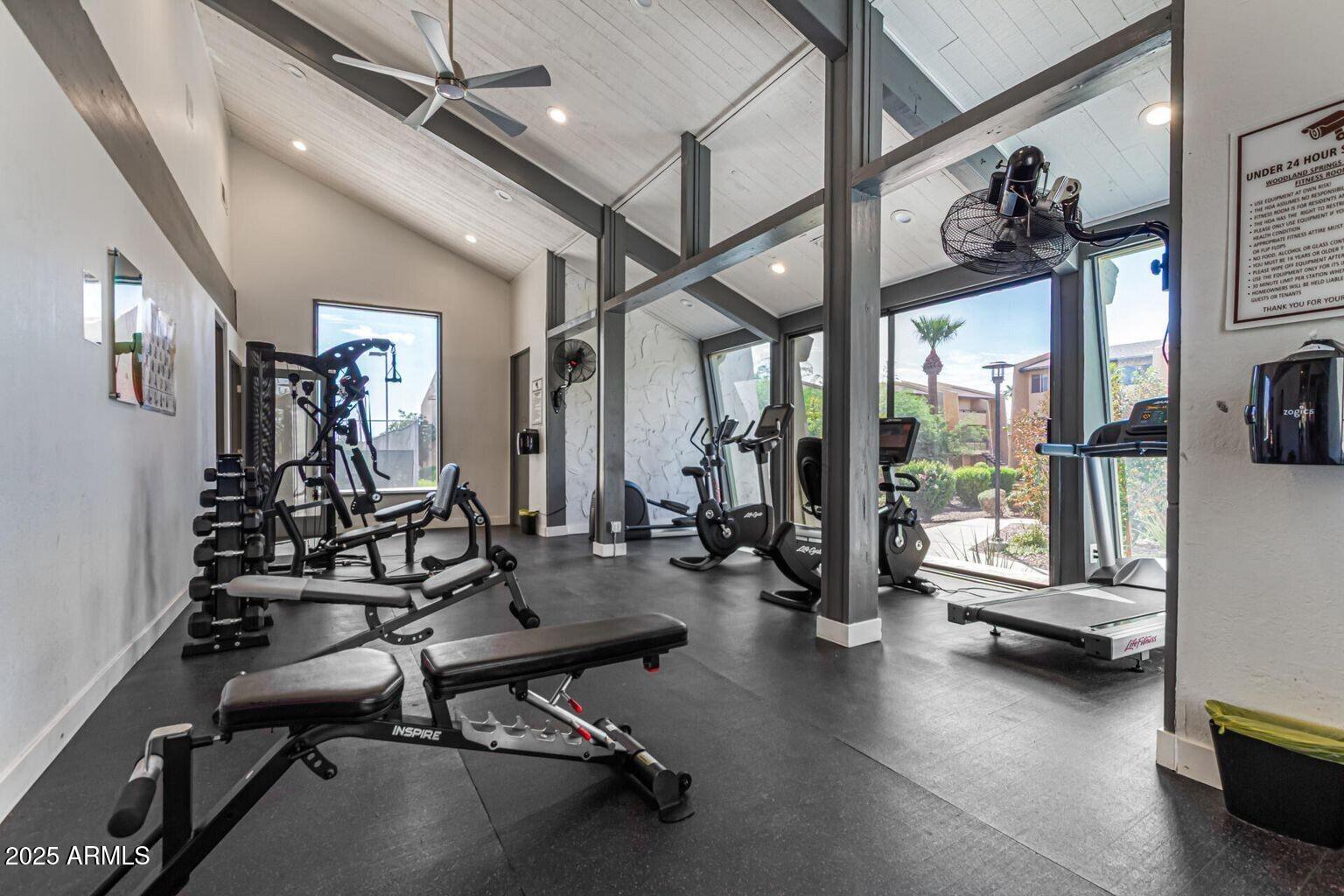 8055 East Thomas Road, Unit M101 Scottsdale, AZ 85251 - Photo 28 of 33 a room with gym equipment and large windows