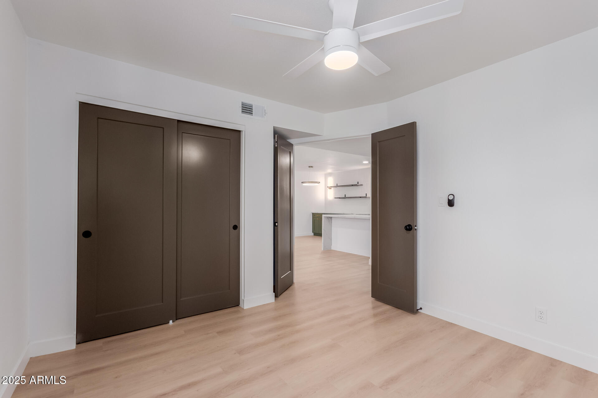 8055 East Thomas Road, Unit M101 Scottsdale, AZ 85251 - Photo 9 of 33 a view of empty room with a ceiling fan