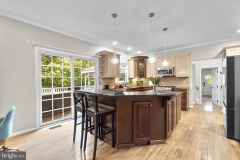 a stove top oven sitting inside of a kitchen
