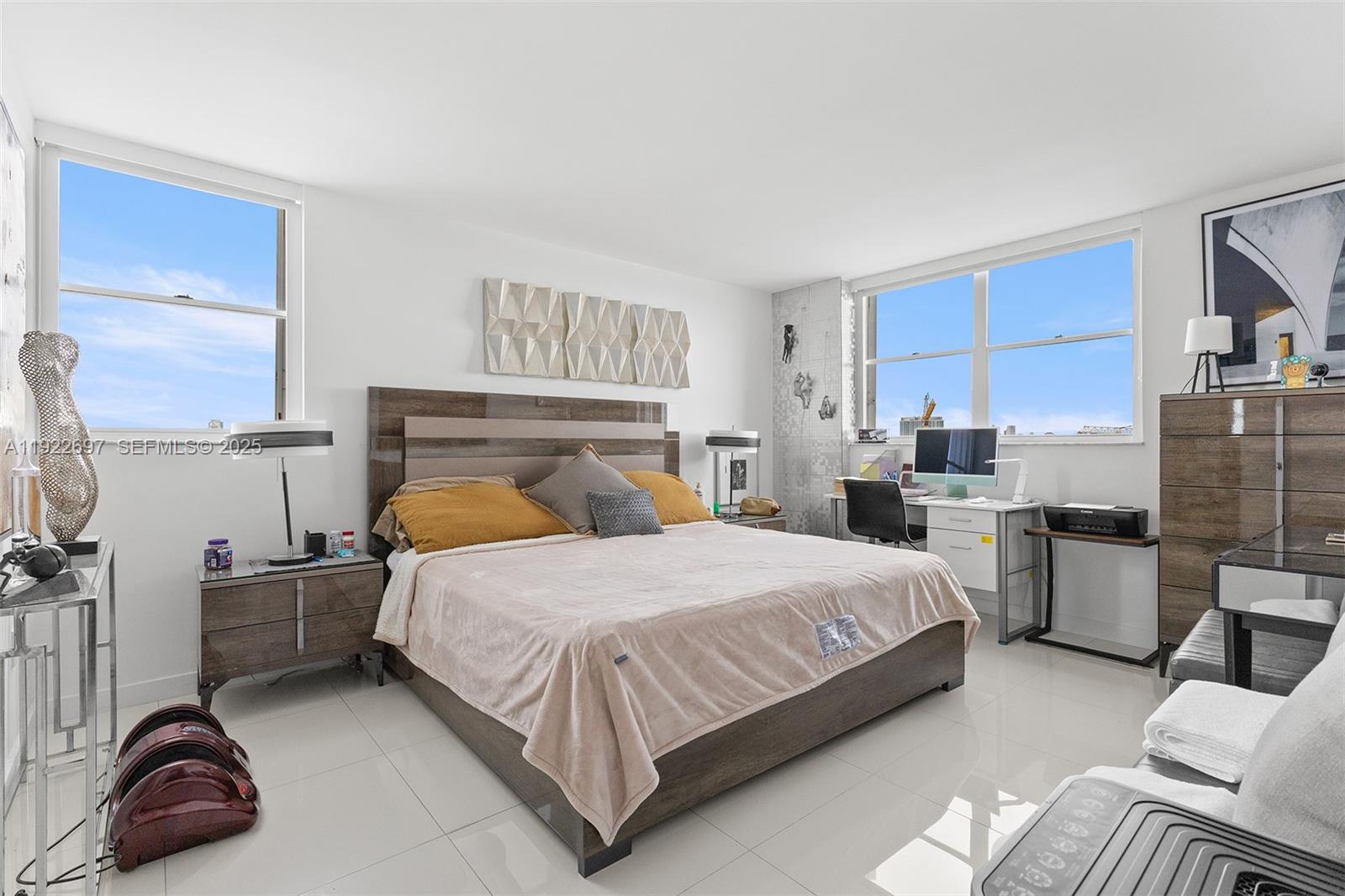 1775 Washington Avenue, Unit 14F Miami Beach, FL 33139 - Photo 12 of 25 a bedroom with a bed furniture and kitchen view