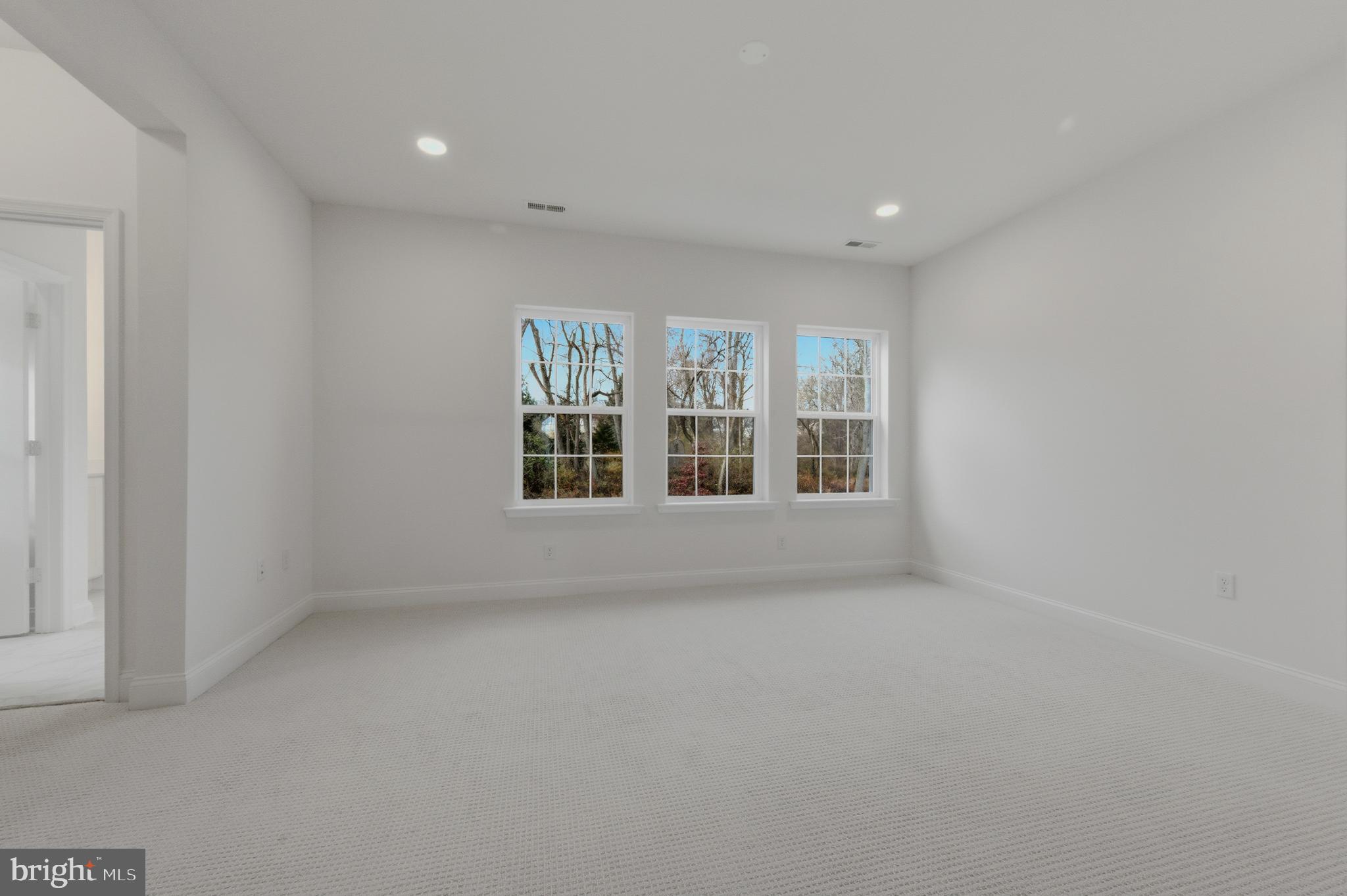 253 Grove View Drive Hockessin, DE 19707 - Photo 13 of 25 an empty room with windows
