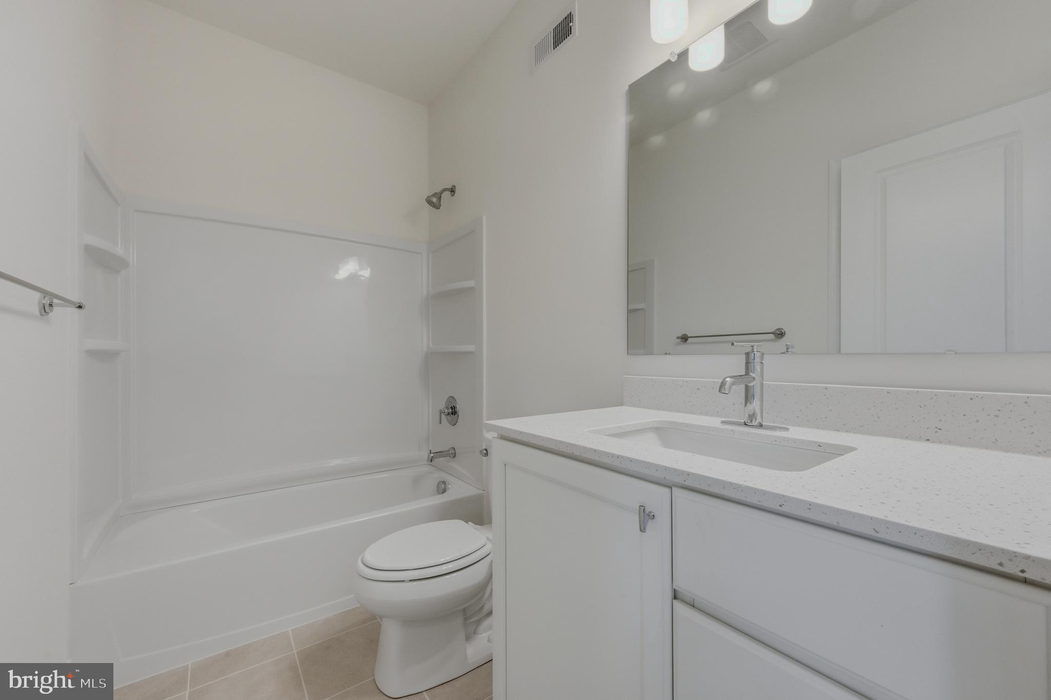 253 Grove View Drive Hockessin, DE 19707 - Photo 19 of 25 a bathroom with a sink a toilet and shower
