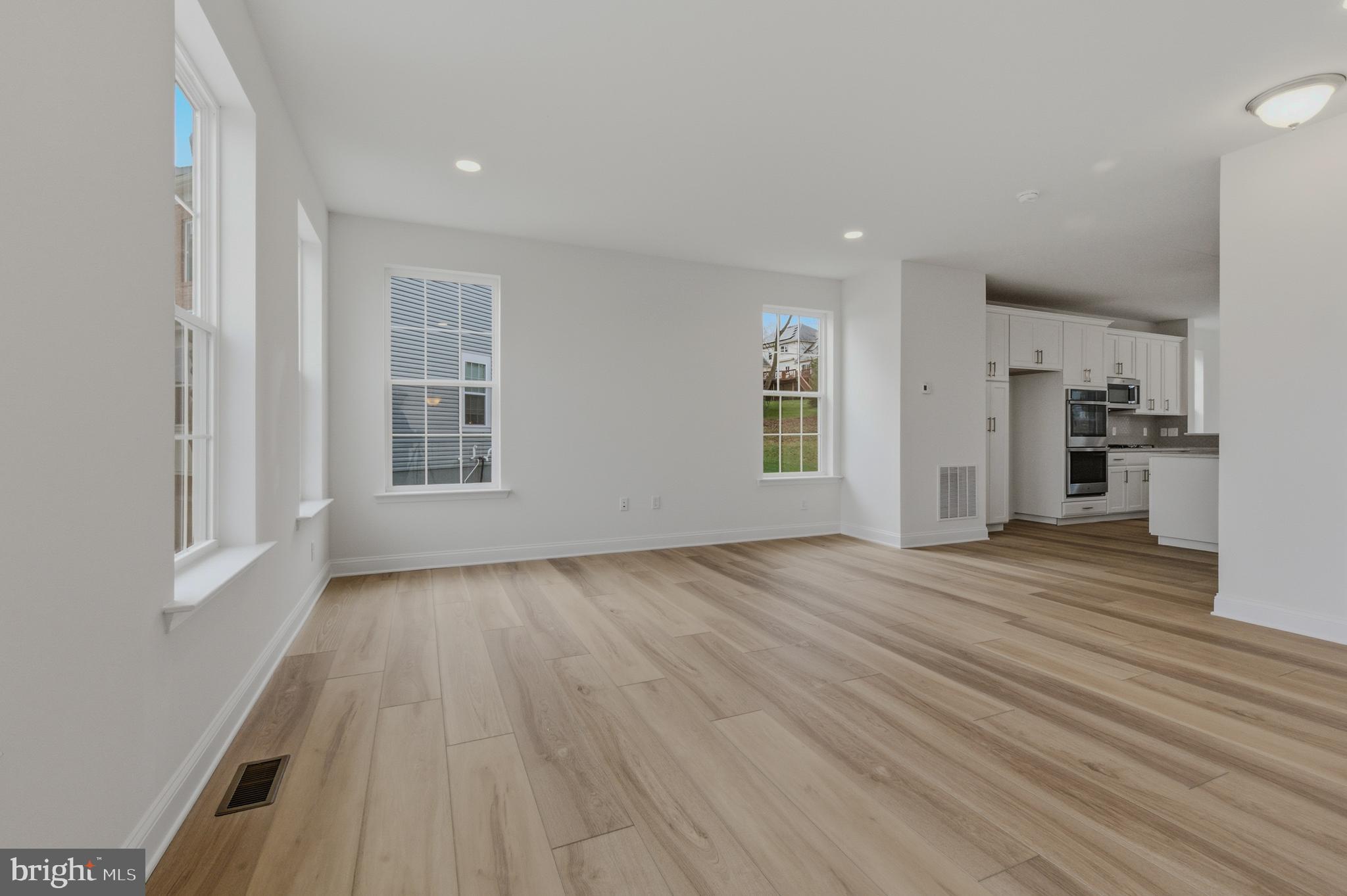 253 Grove View Drive Hockessin, DE 19707 - Photo 4 of 25 wooden floor in an empty room with a window