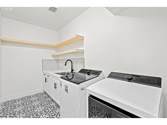 a spacious bedroom with a bed and a large window