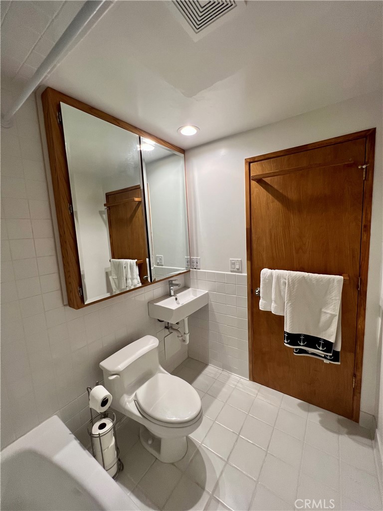 12 Coach Road Rancho Palos Verdes, CA 90275 - Photo 12 of 26 a bathroom with a toilet sink and mirror