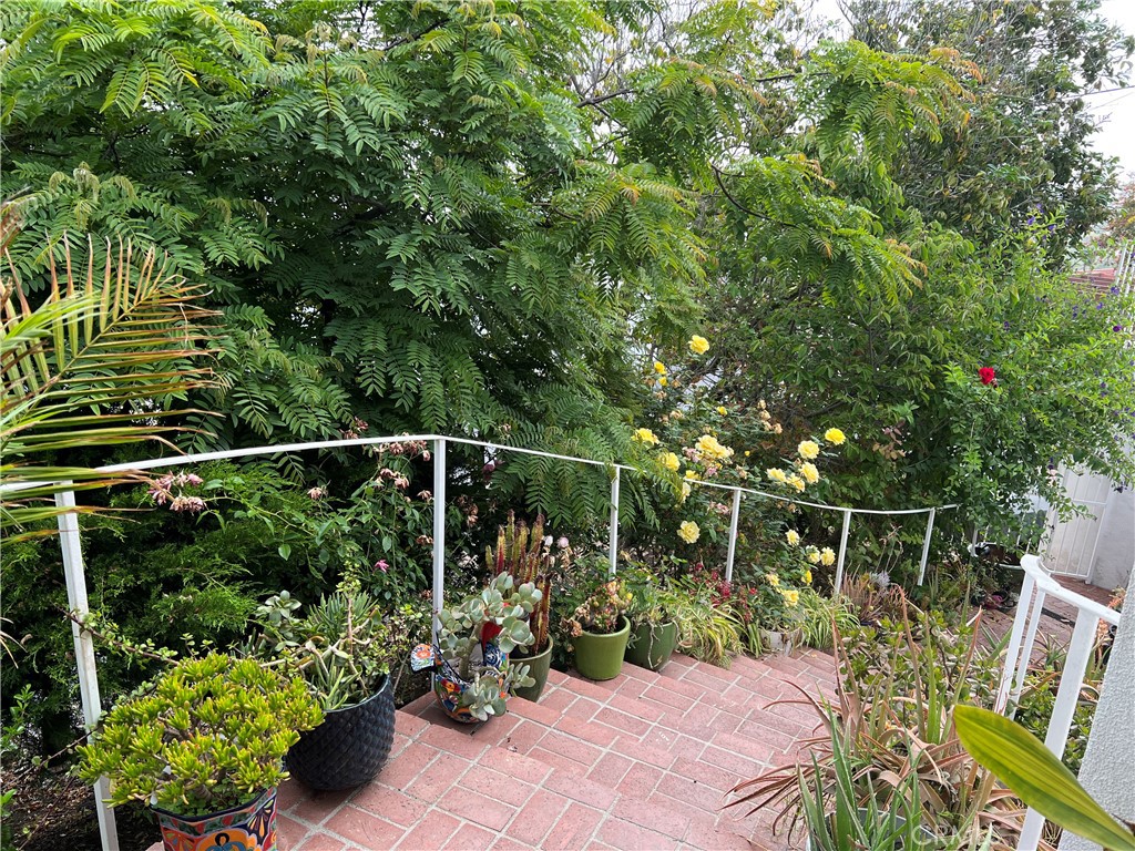 12 Coach Road Rancho Palos Verdes, CA 90275 - Photo 19 of 26 a view of a chair and table in the garden