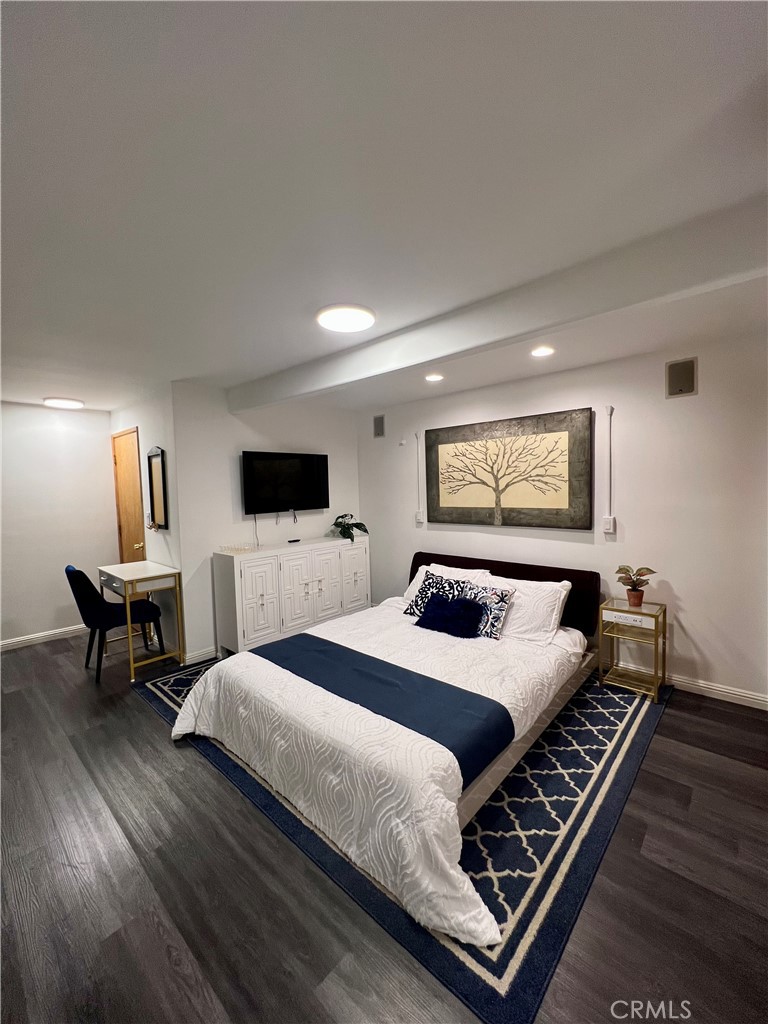 12 Coach Road Rancho Palos Verdes, CA 90275 - Photo 4 of 26 a bedroom with a bed and a flat screen tv