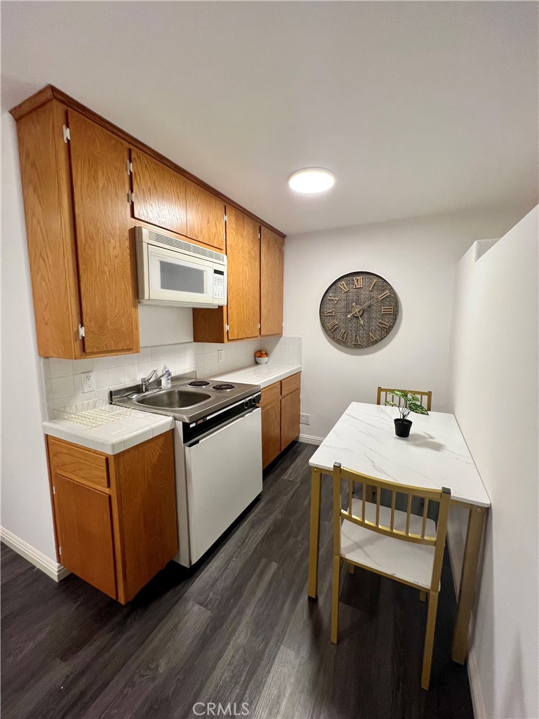 12 Coach Road Rancho Palos Verdes, CA 90275 - Photo 9 of 26 a kitchen with stainless steel appliances granite countertop a stove a sink and a refrigerator