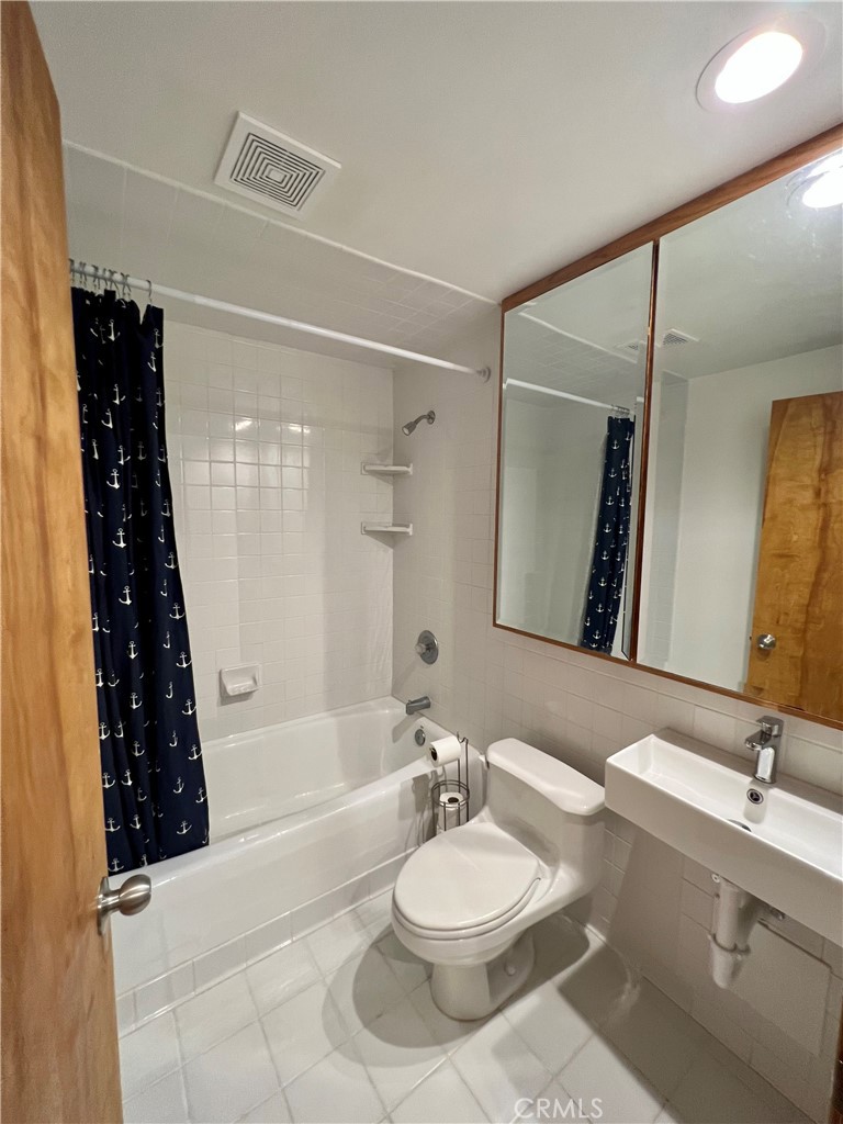 12 Coach Road Rancho Palos Verdes, CA 90275 - Photo 10 of 26 a bathroom with a bathtub a sink a vanity and a shower