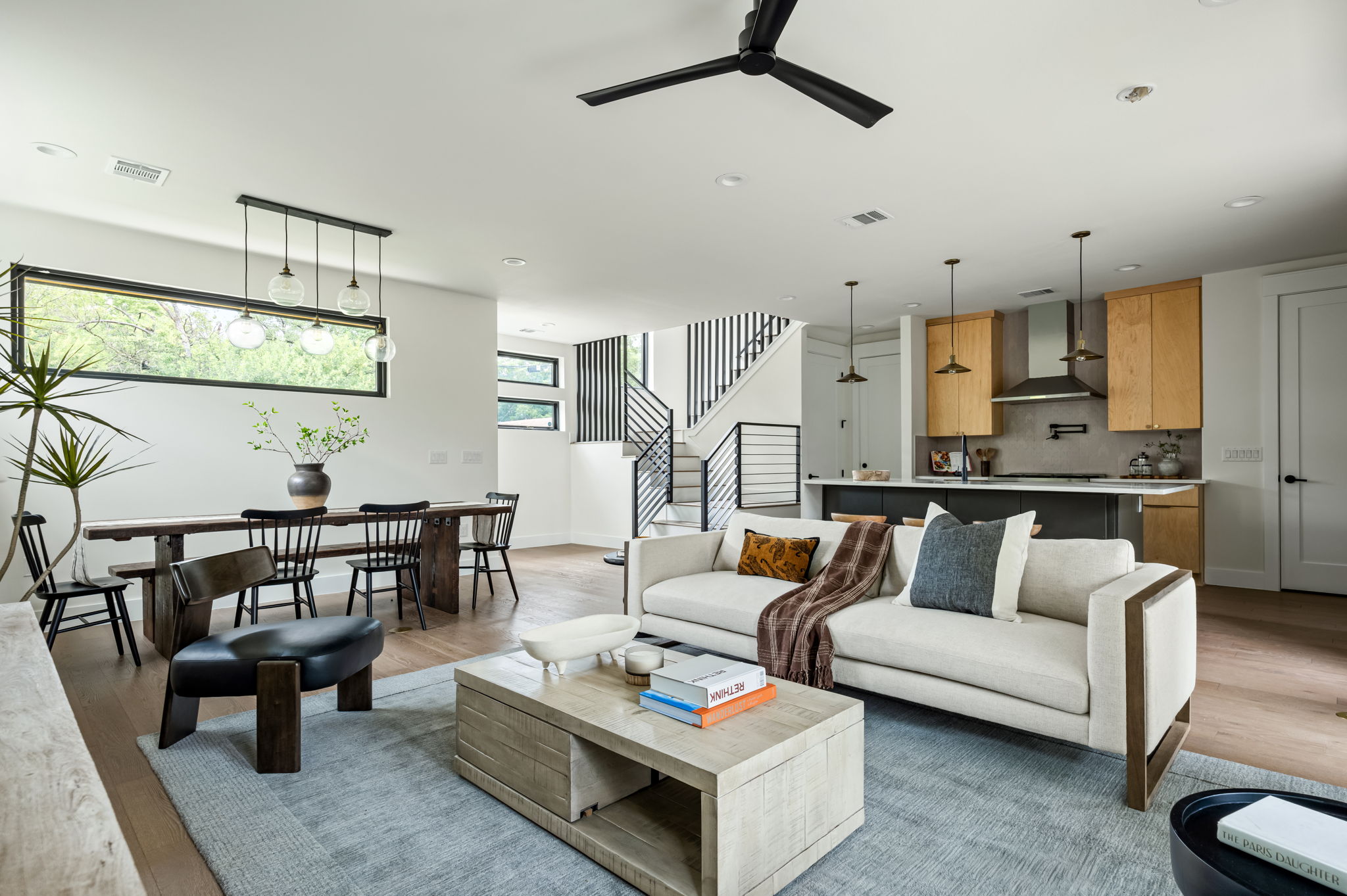 3508 Lyons Road Austin, TX 78702 - Photo 2 of 40 An open-concept living area seamlessly connects a well-appointed kitchen, dining space, and comfortable living room.