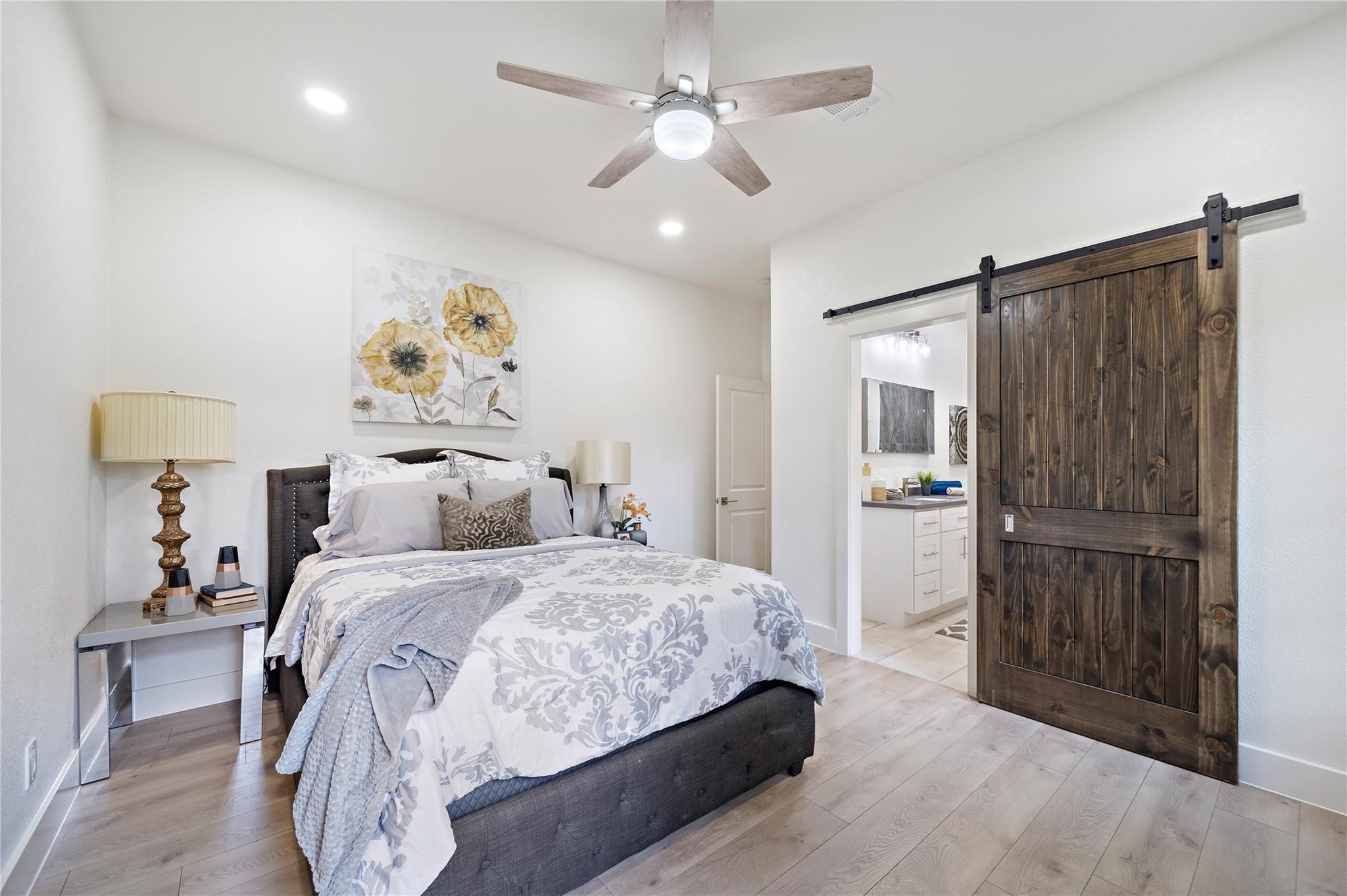 459 Live Oak Road Wharton, TX 77488 - Photo 19 of 27 a bedroom with a bed and a chandelier