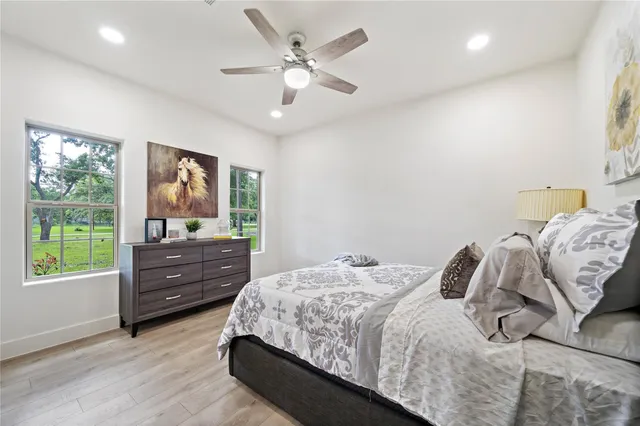 a bedroom with a bed and a dresser