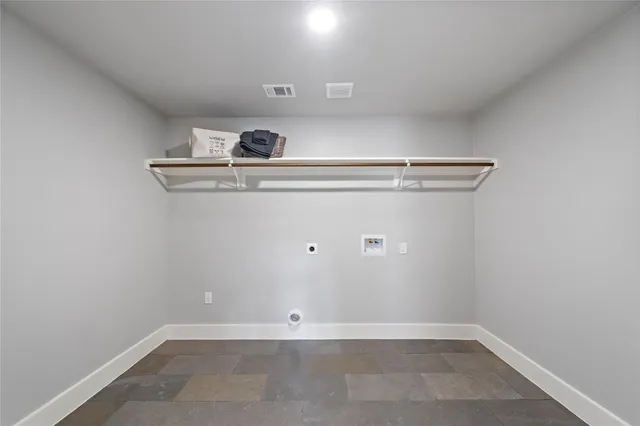 a view of utility room with closet