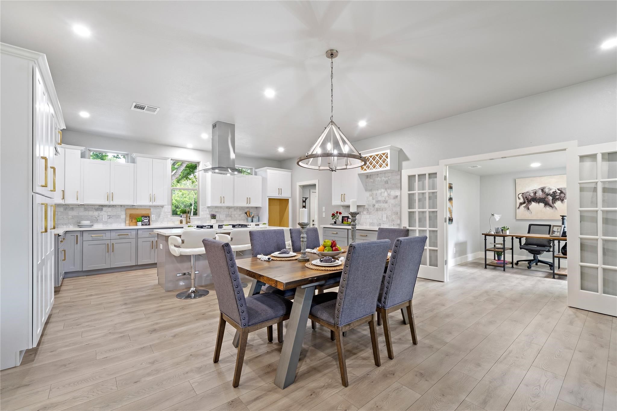 459 Live Oak Road Wharton, TX 77488 - Photo 4 of 27 a view of a dining room with furniture a chandelier and wooden floor