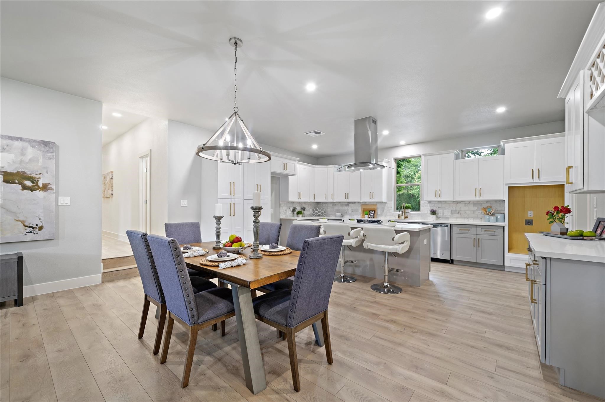 459 Live Oak Road Wharton, TX 77488 - Photo 5 of 27 a dining room with furniture a chandelier and wooden floor