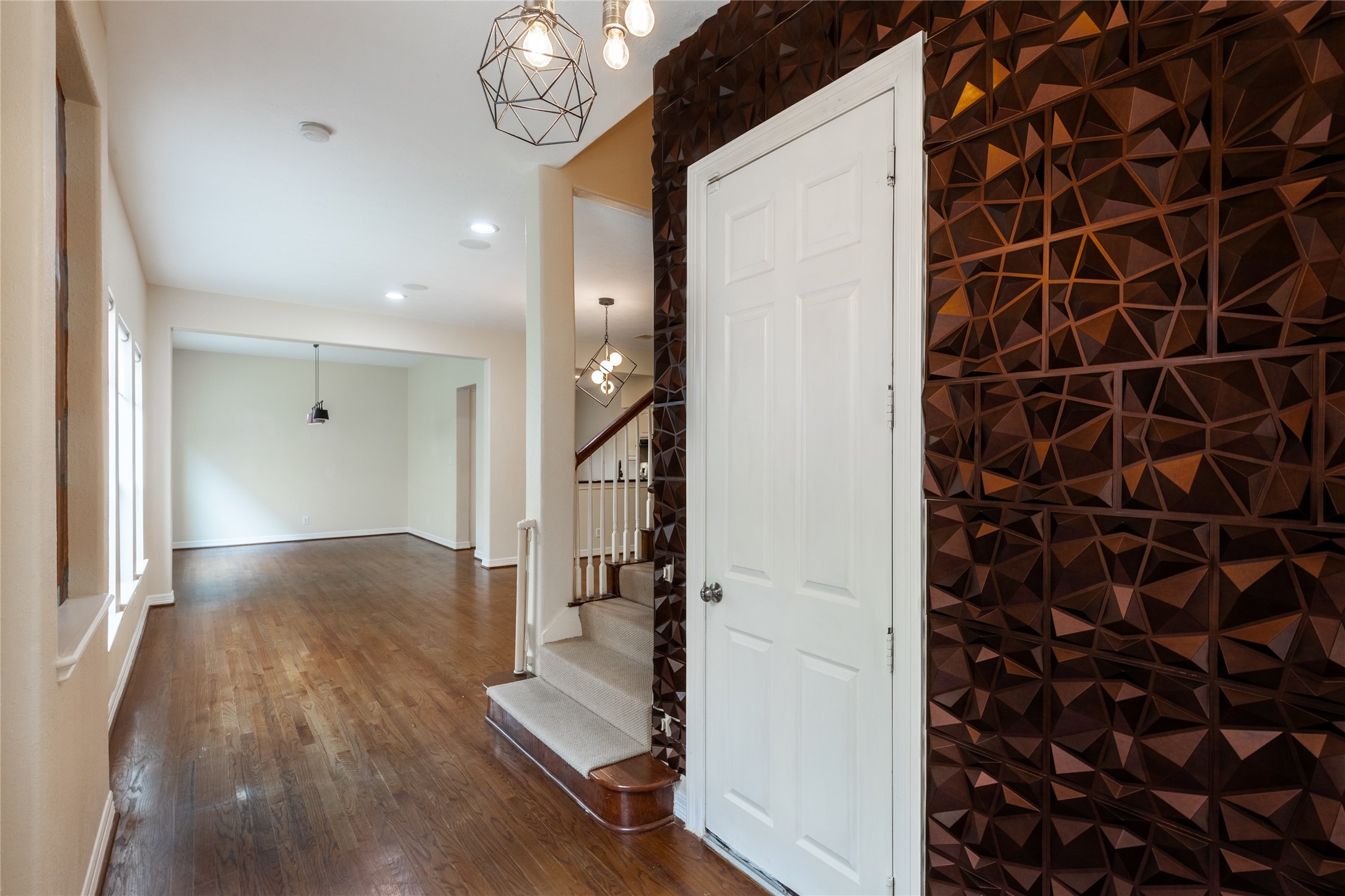 2923 Royal Oaks Crest Houston, TX 77082 - Photo 3 of 31 a view of a hallway with wooden floor and staircase