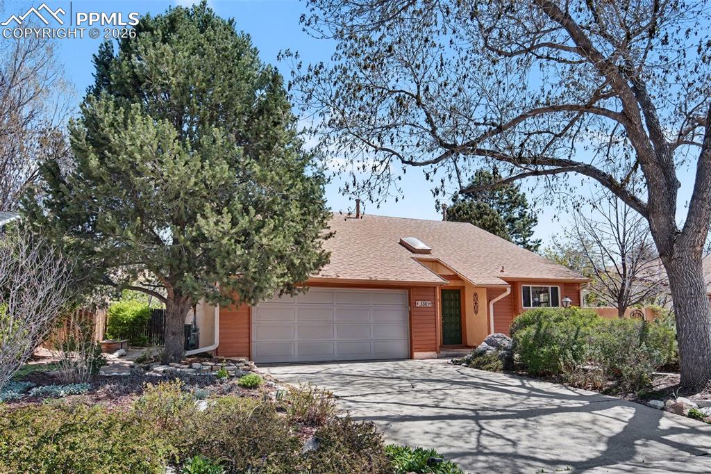 5301 Pinon Valley Road Colorado Springs, CO 80919 - Photo 3 of 27 a view of a house with a yard