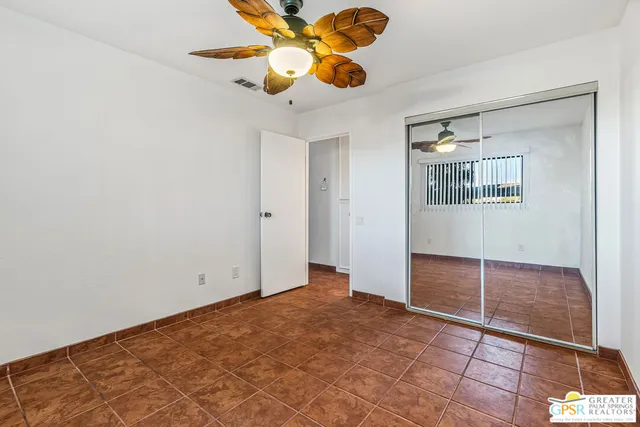 a bathroom with a sink a mirror a vanity and a shower