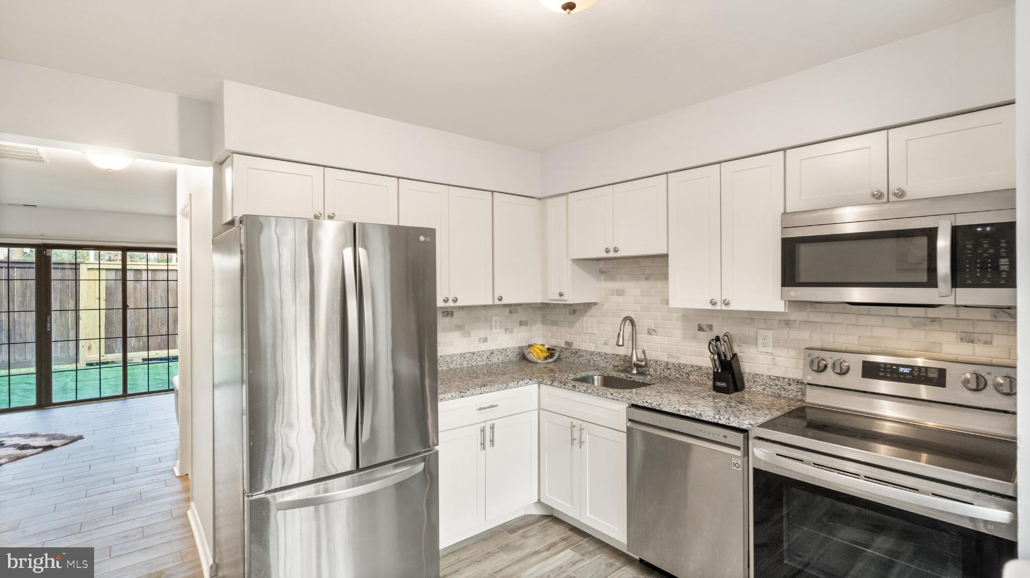 2017 Headlands Circle Reston, VA 20191 - Photo 14 of 28 Modern kitchen with stainless steel appliances