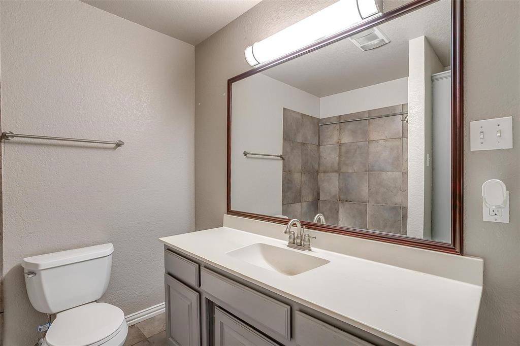 11972 Younger Court Azle, TX 76020 - Photo 26 of 40 a bathroom with a sink toilet vanity and shower