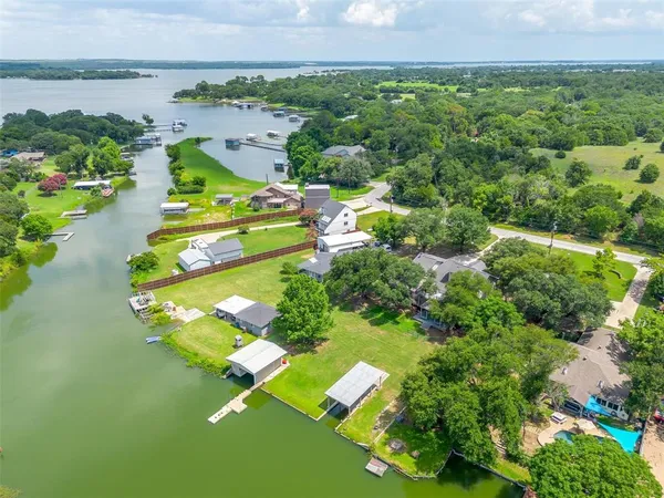 an aerial view of a house with a garden and swimming pool