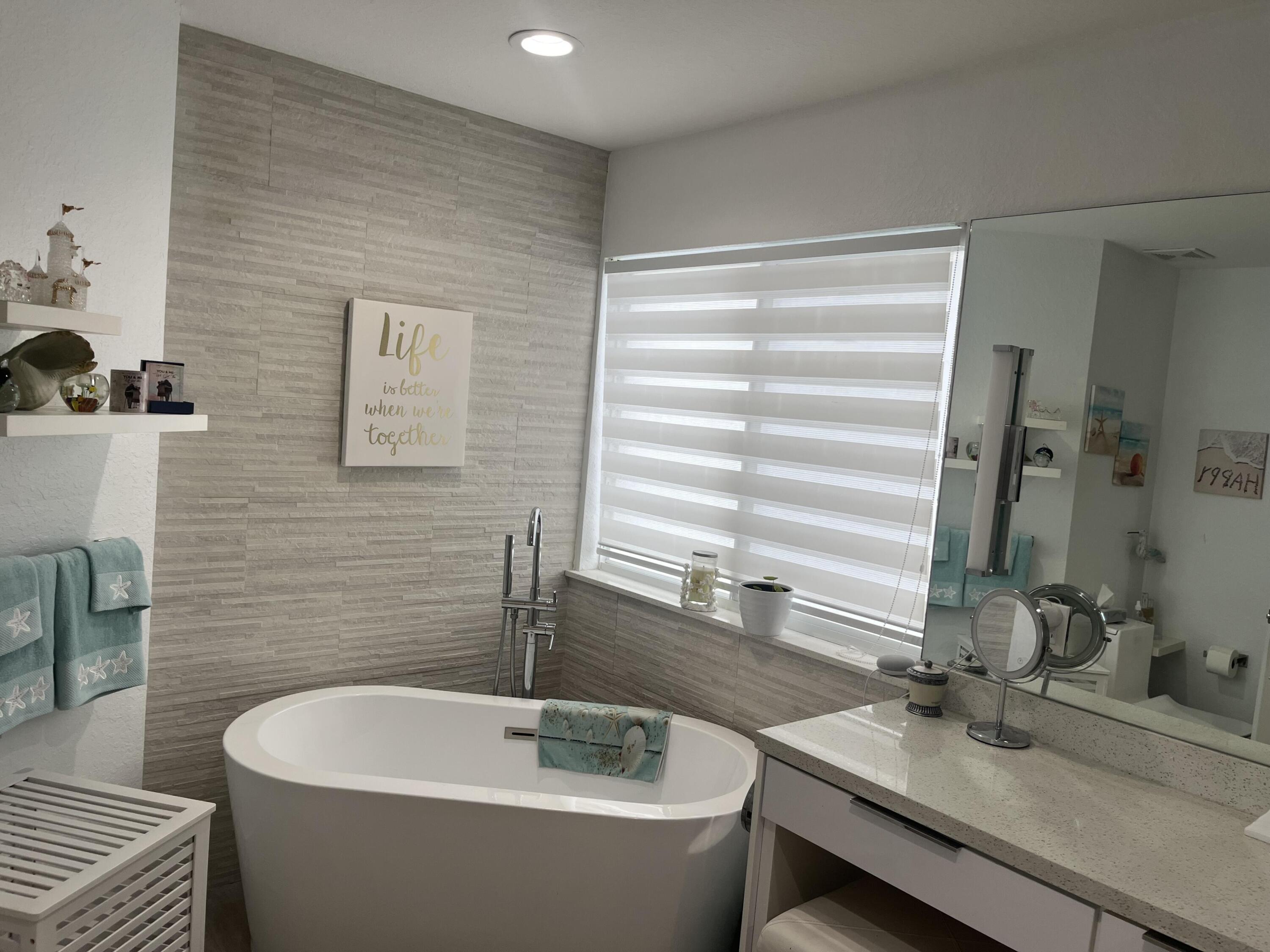 325 Calusa Street, Unit 96 Key Largo, FL 33037 - Photo 9 of 17 a bathroom with a bathtub and sink