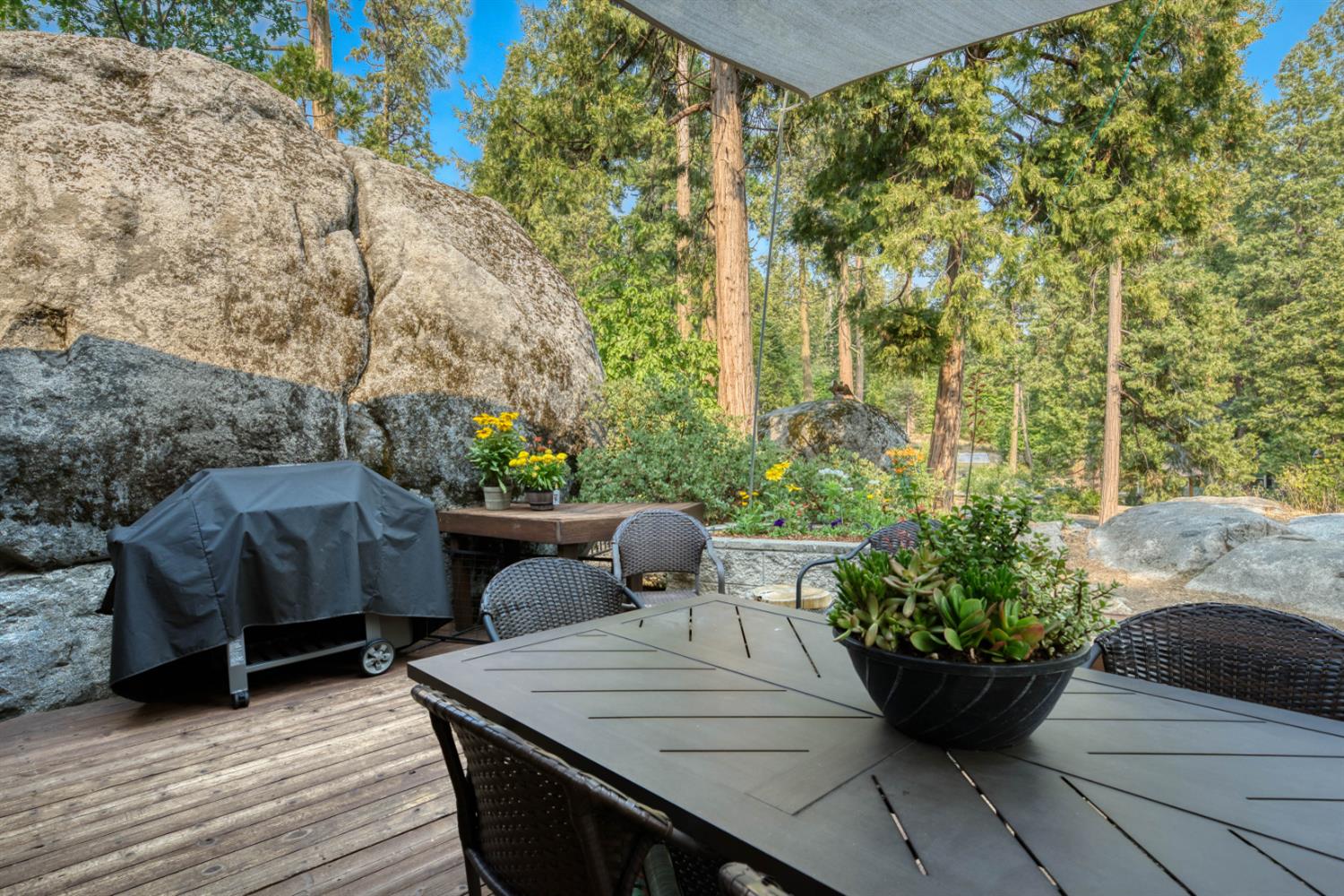38848 Ridge Road Shaver Lake, CA 93664 - Photo 19 of 81 a view of a couches and table in the patio