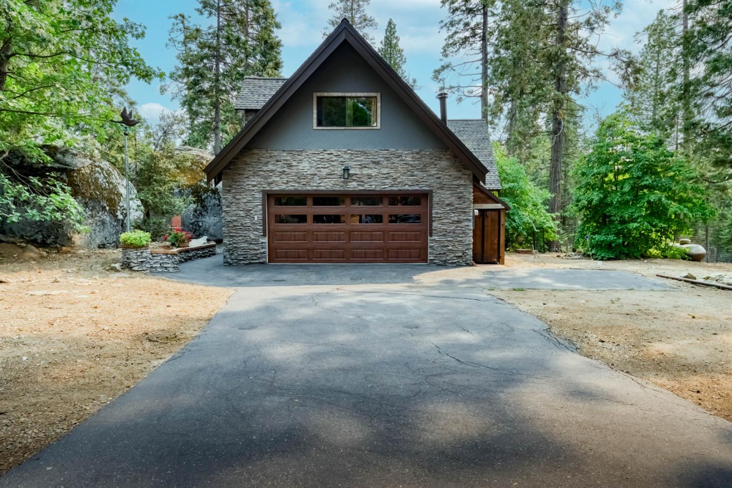 38848 Ridge Road Shaver Lake, CA 93664 - Photo 2 of 81 a front view of a house with a yard