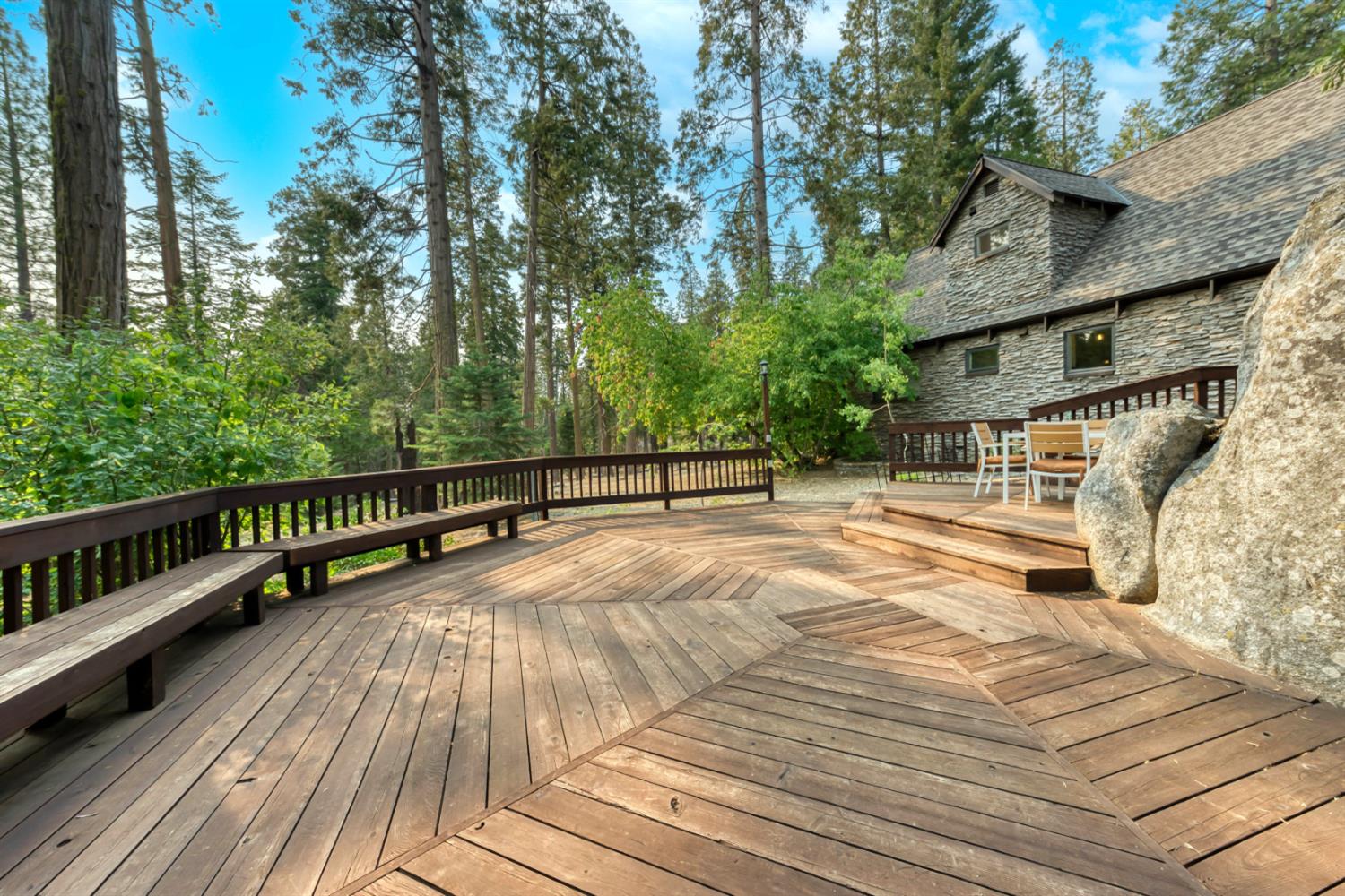 38848 Ridge Road Shaver Lake, CA 93664 - Photo 23 of 81 a view of balcony with wooden floor and fence and trees