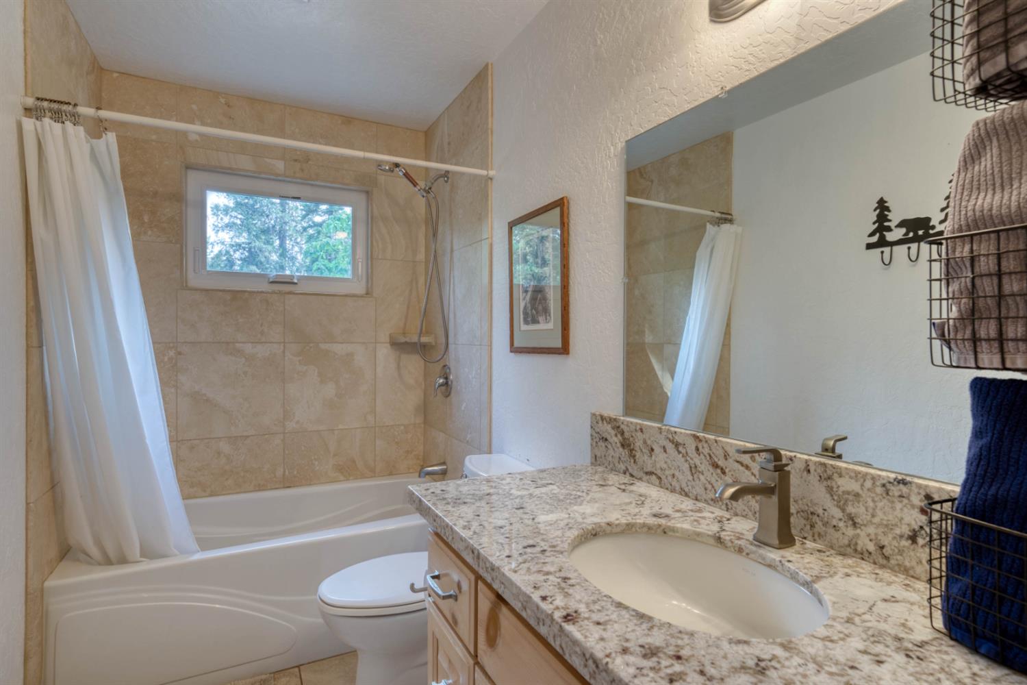 38848 Ridge Road Shaver Lake, CA 93664 - Photo 37 of 81 a bathroom with a granite countertop sink toilet and shower