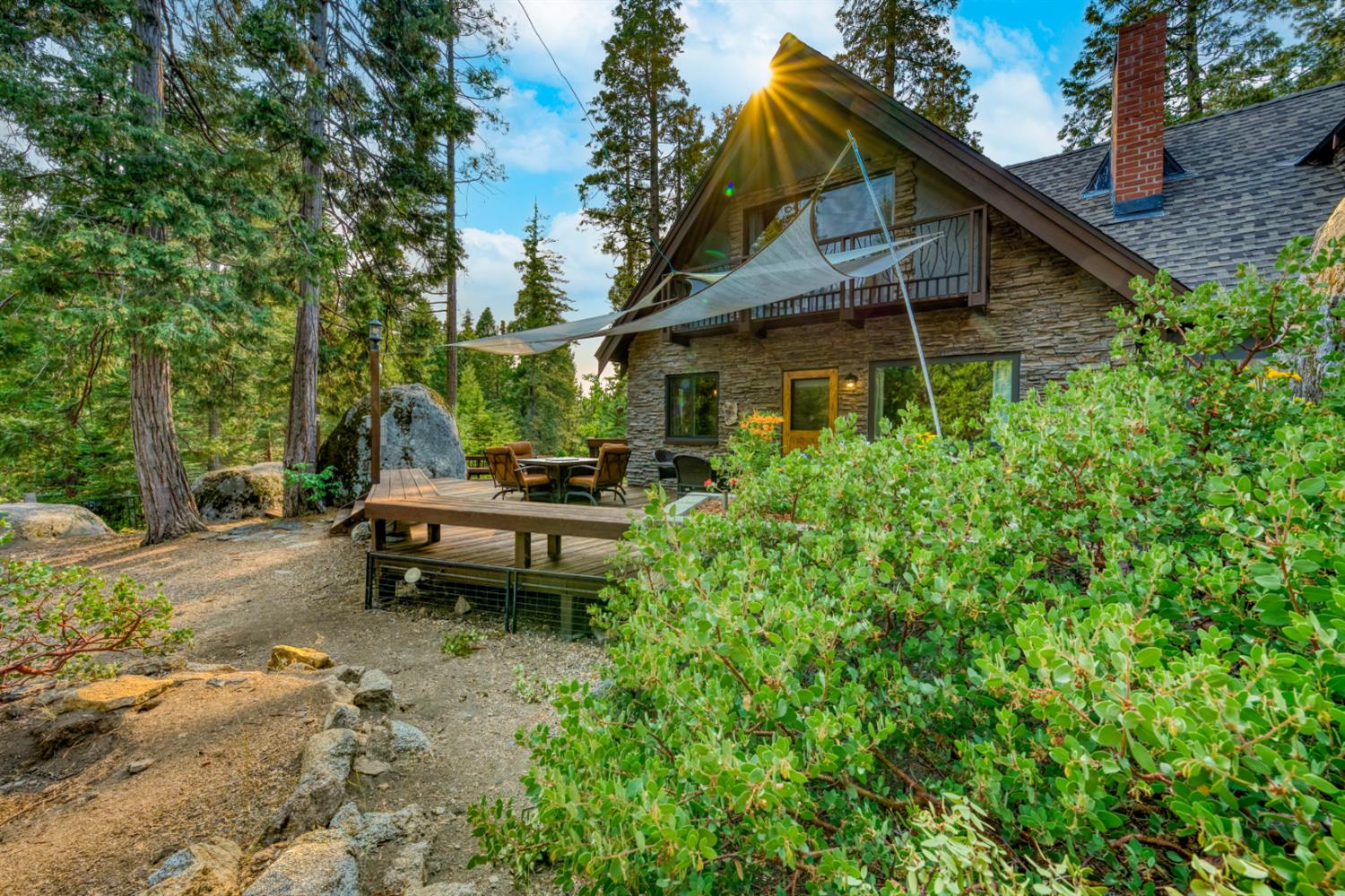 38848 Ridge Road Shaver Lake, CA 93664 - Photo 4 of 81 a view of a house with a yard and sitting area