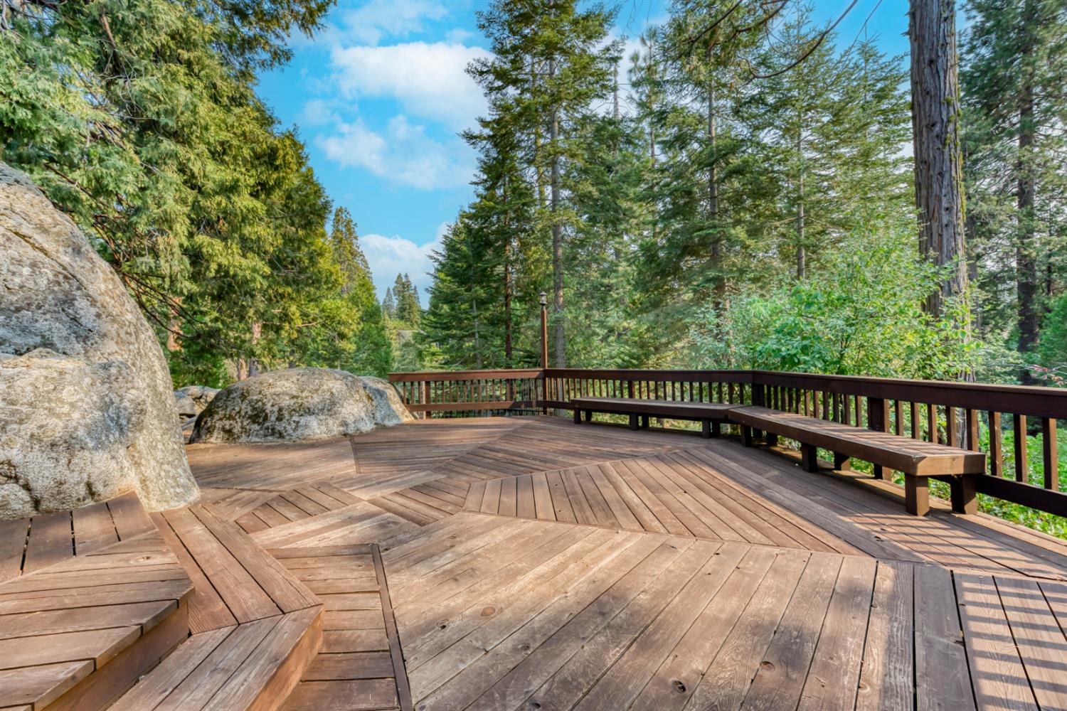 38848 Ridge Road Shaver Lake, CA 93664 - Photo 56 of 81 a view of balcony with wooden floor and fence