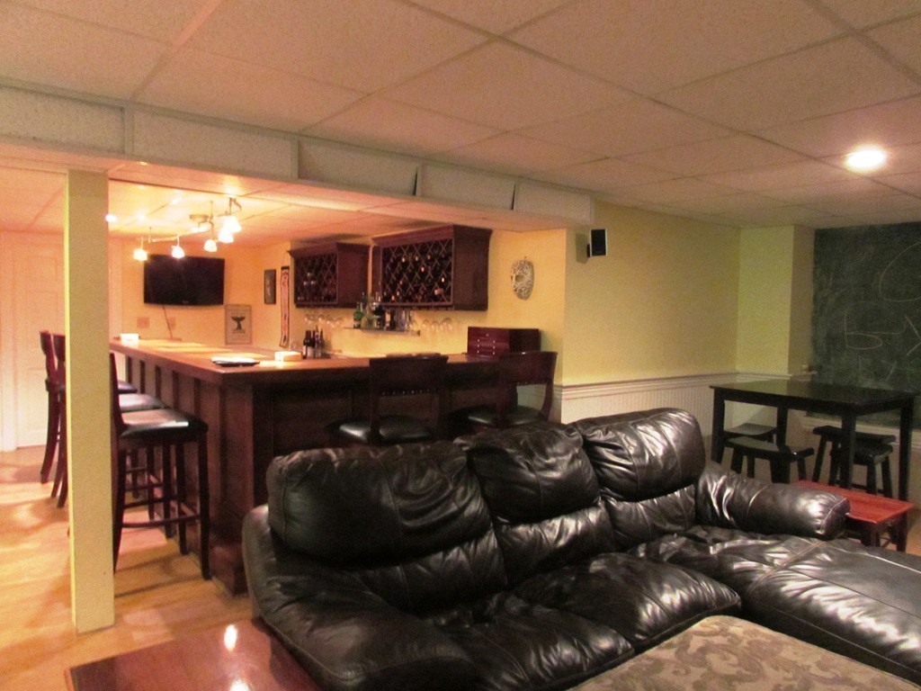 68 Herrick Road Boxford, MA 01921 - Photo 17 of 25 a living room with furniture and a fireplace