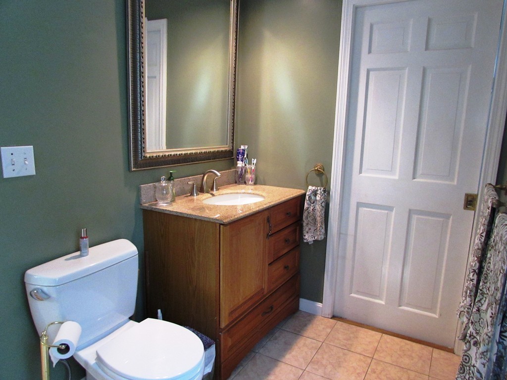 68 Herrick Road Boxford, MA 01921 - Photo 6 of 25 a bathroom with a toilet sink and mirror