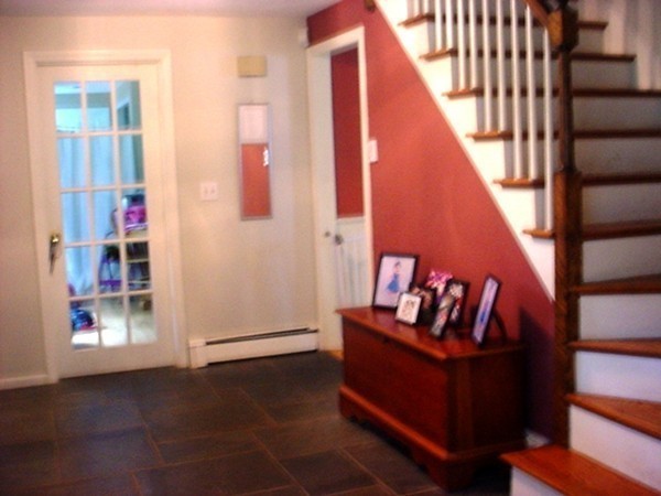 68 Herrick Road Boxford, MA 01921 - Photo 7 of 25 a view of an entryway with wooden floor and door