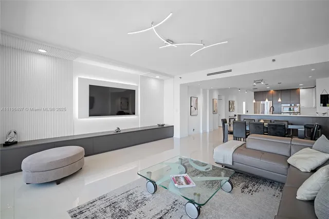 a dining room with kitchen island a table and chairs