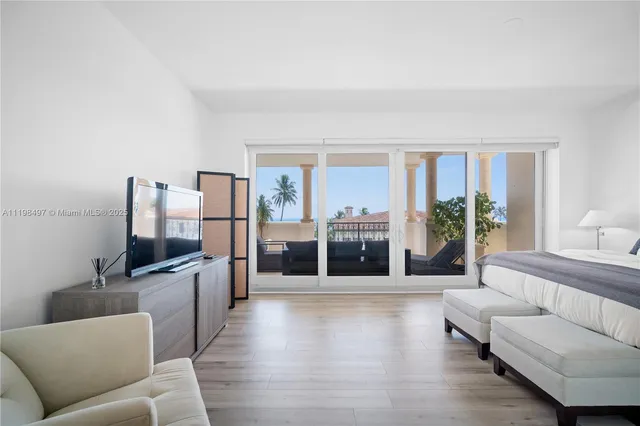 a bedroom with a bed and a potted plant