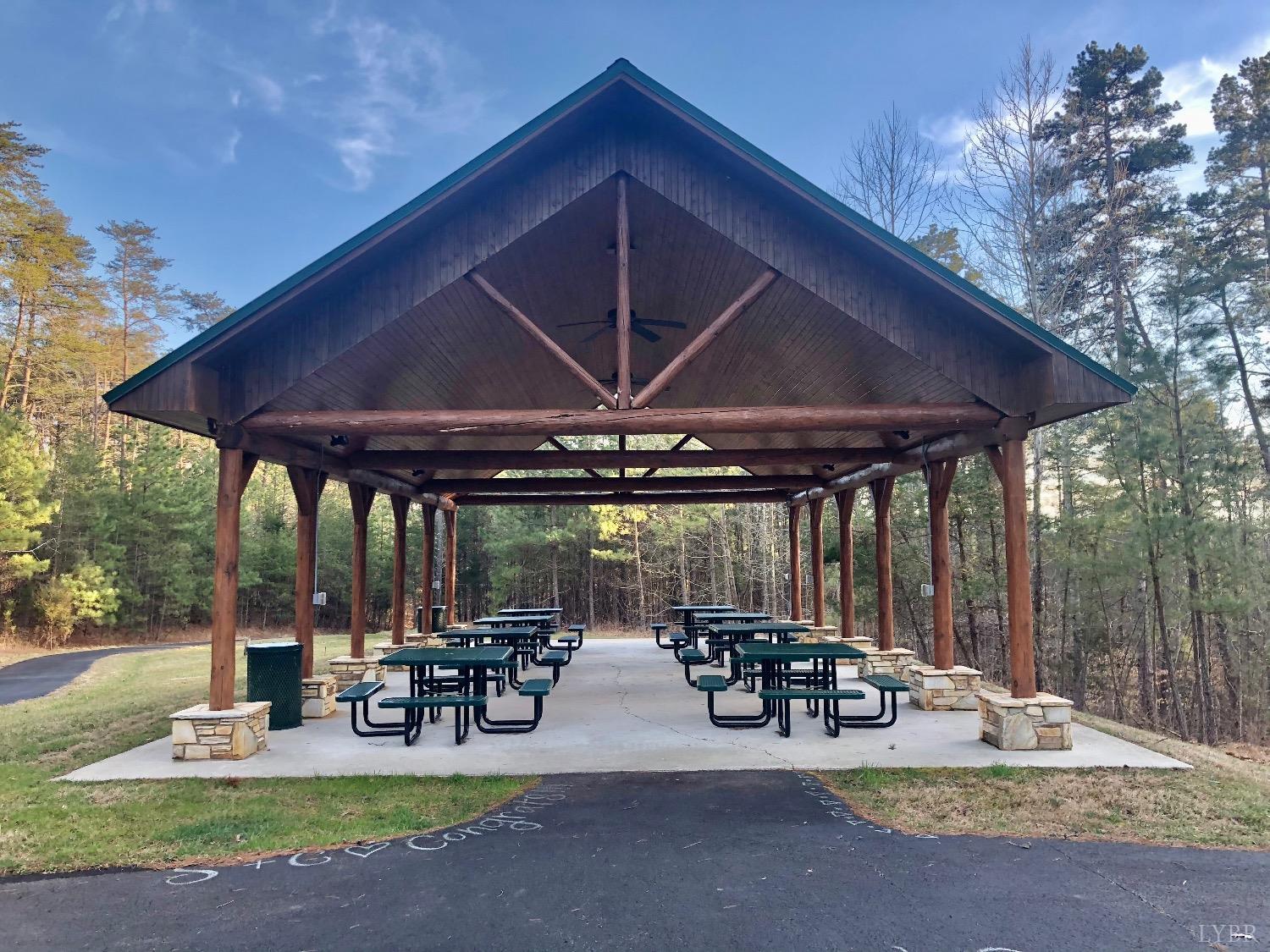 a view of a patio with table and chairs under an umbrella