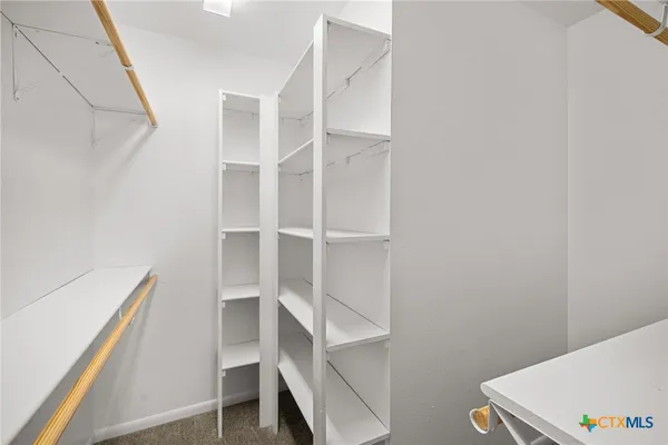 a view of an empty walk in closet