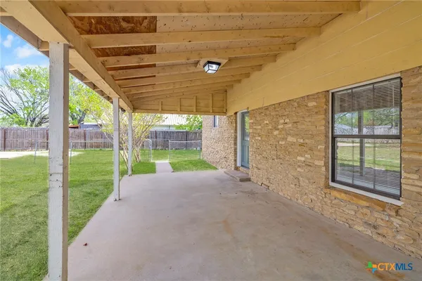 a view of a porch with a backyard